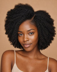 Black woman with natural-black afro-textured hair and a seamless natural part, showing the achievable look