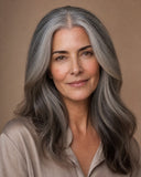 Elegant woman with natural salt-and-pepper grey hair and a flawless middle part, showing the achievable look