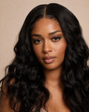 Model showing the achievable look: natural-black loose-wave hair with a seamless middle part