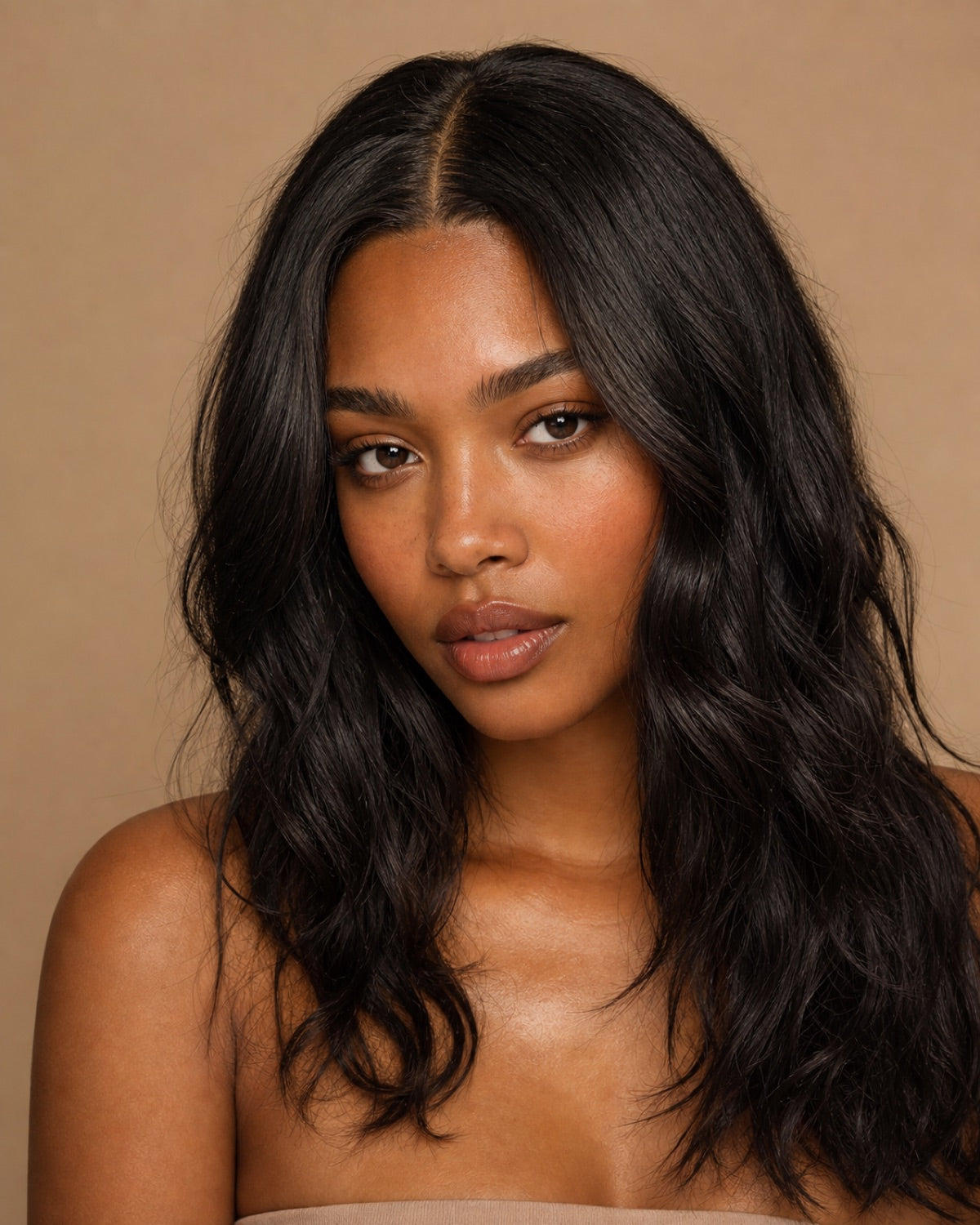 Model with natural-black natural-wave hair and a seamless middle part showing the achievable look