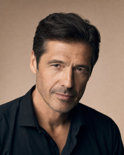 Confident man with a full, natural head of hair showing the achievable look