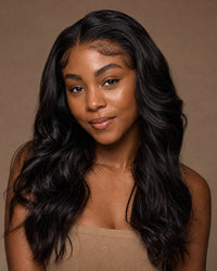 Model with glossy natural-black natural-wavy front-lace wig hair