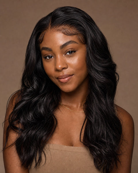 Model with glossy natural-black natural-wavy front-lace wig hair